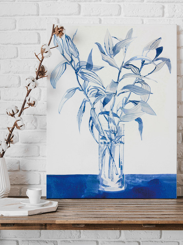 A print of a painting of watercolour lilies. They are painted blue and are standing in a tall glass jar.